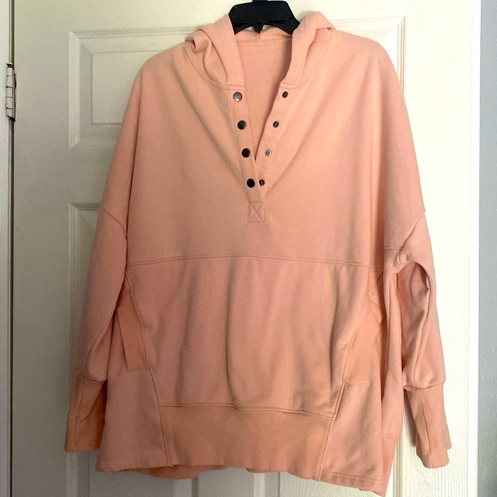 Long sleeve pink super soft and heavy sweatshirt has pockets and hood.